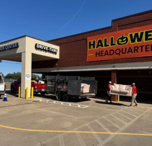 Junk Quest crew unloading donated furniture and household items at a Goodwill donation center in McKinney, TX as part of their eco-friendly junk removal and donation service.