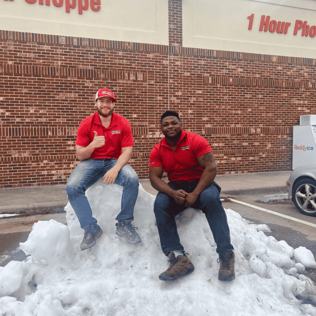 Junk removal crew hauling storm debris and damaged household items after a winter freeze in Collin County, Texas