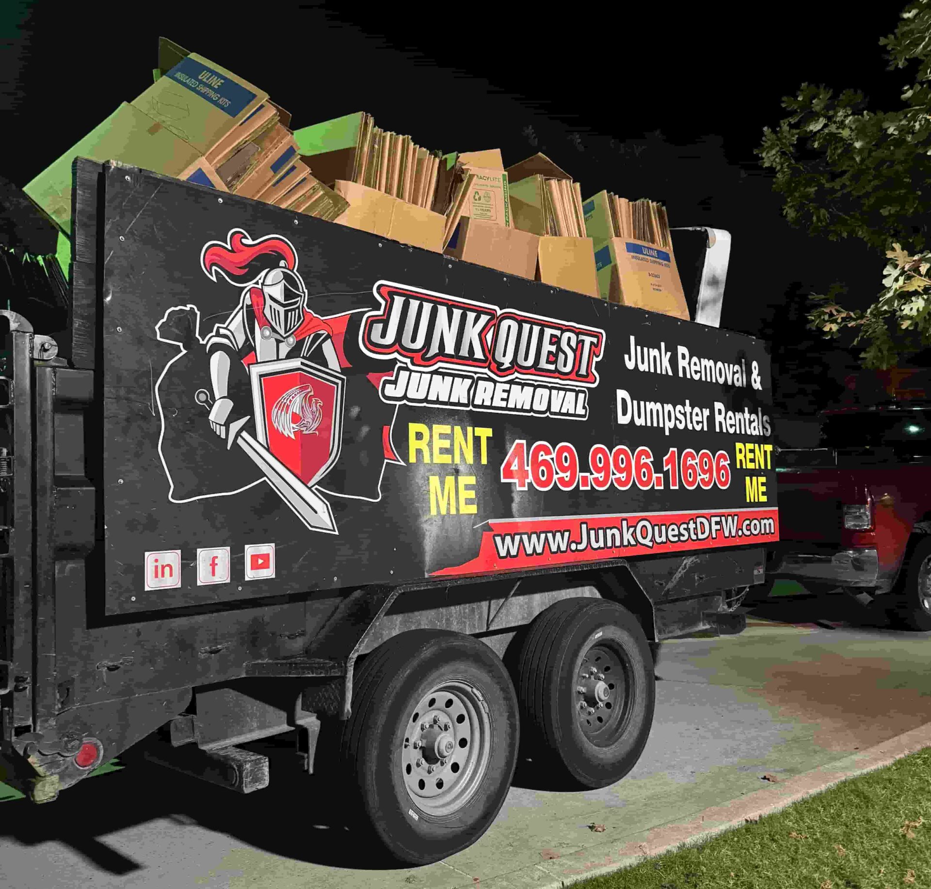 Junk Quest trailer loaded with junk during a professional junk removal service in McKinney, TX — local hauling and dumpster rental experts serving North Texas.