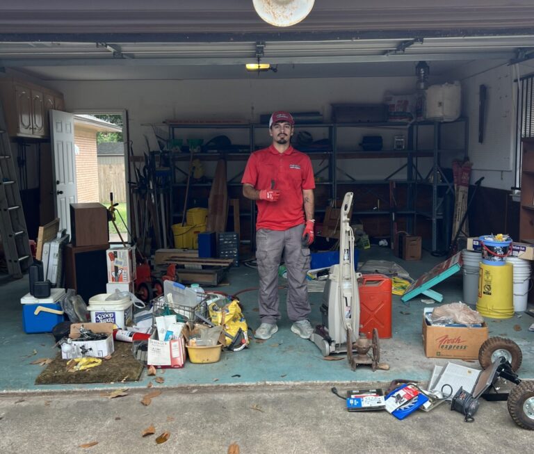Junk Quest technician preparing to clear a heavily cluttered space during a hoarding cleanout in Dallas, TX.
