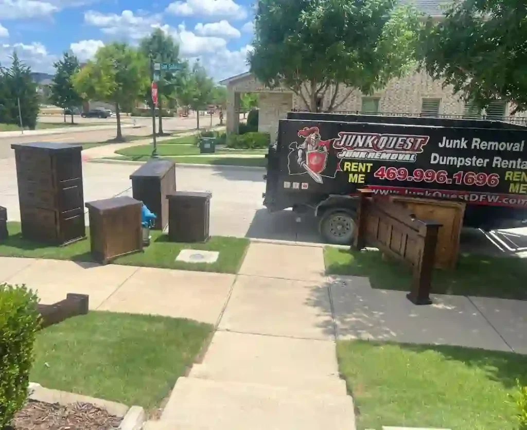 Junk Quest team removing old furniture during a junk removal job in Wylie, TX