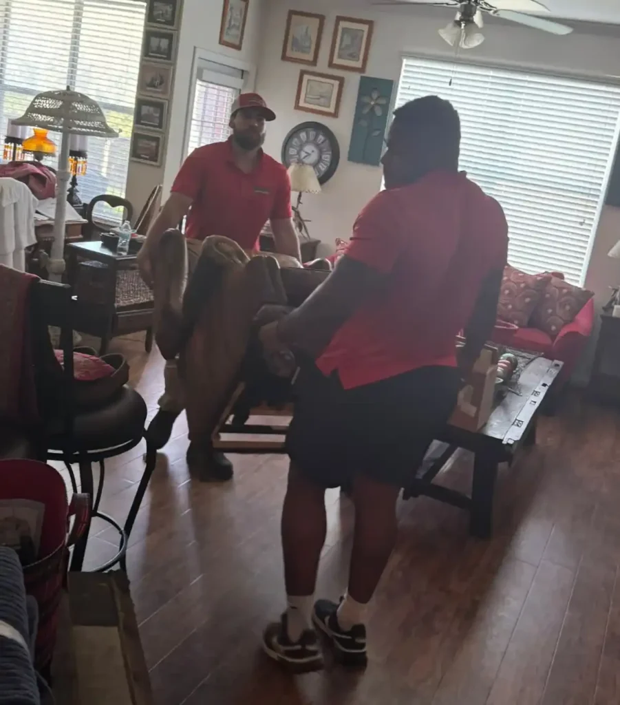 Junk Quest team carefully removing furniture during a hoarding cleanout in McKinney, TX