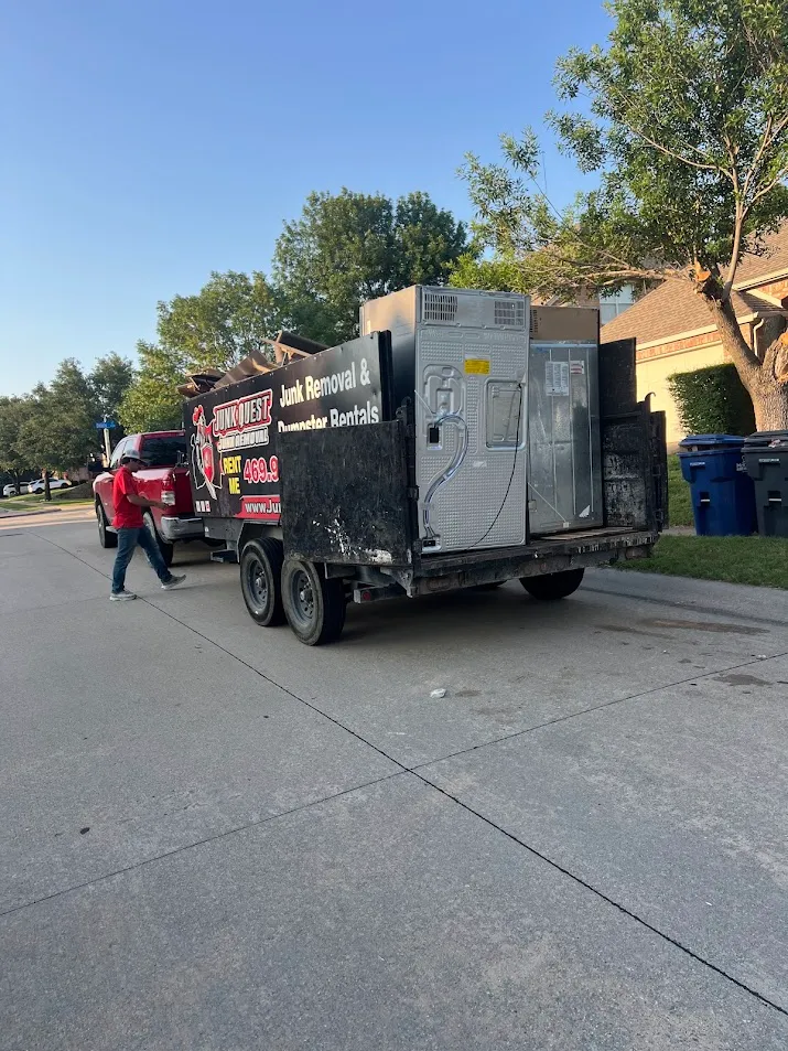 Junk Quest Removal truck hauling appliances during an estate cleanout in North Dallas