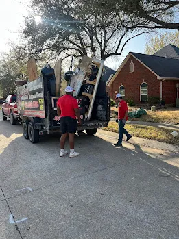 Junk Quest Removal crew loading furniture during a prepared foreclosure cleanout in North Dallas