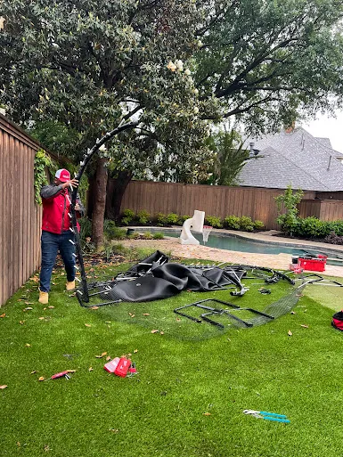 Junk Quest Removal team dismantling and staging garage junk during preparation for garage junk removal service in North Dallas