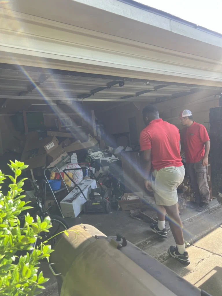 Team performing garage junk removal services and clearing clutter in a North Dallas home