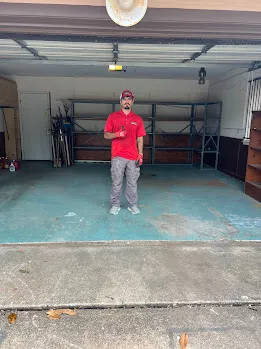 Junk Quest Removal team standing inside an empty garage after completing a professional property cleanout in North Dallas