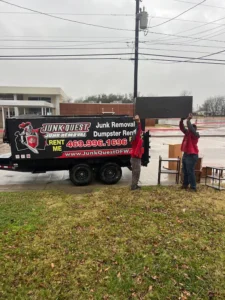 Junk Quest Removal crew loading old appliances and bulky items into a trailer during eco-friendly appliance removal in North Dallas