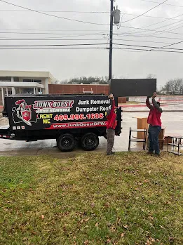 Junk Quest Removal crew removing furniture and household items during a property cleanout in North Dallas