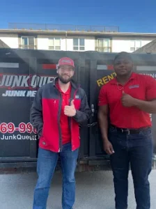 Junk Quest Removal team standing in front of a loaded trailer during a professional foreclosure cleanout in North Dallas