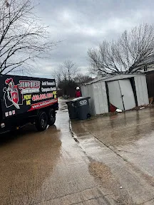 Junk Quest Removal truck parked outside residential property during North Dallas property cleanout preparation