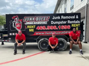 Junk Quest Removal team standing in front of warehouse cleanout trailer in North Dallas