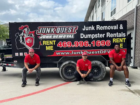 Junk Quest Removal team standing in front of warehouse cleanout trailer in North Dallas