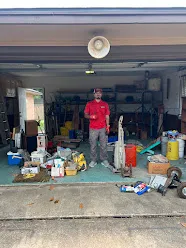 Junk Quest Removal crew standing in cluttered garage during hoarding cleanup services in North Dallas