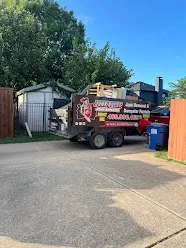 Junk Quest Removal trailer hauling bulky debris during professional hot tub disposal service in North Dallas