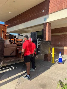 Junk Quest Removal crew loading electronics and bulky items for safe recycling of old computers in North Dallas