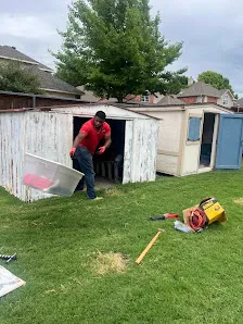 Junk Quest Removal crew removing bulky items during garage cleanout service in North Dallas