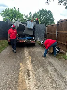 Junk Quest Removal crew loading old electronics and appliances for proper electronic waste disposal in North Dallas