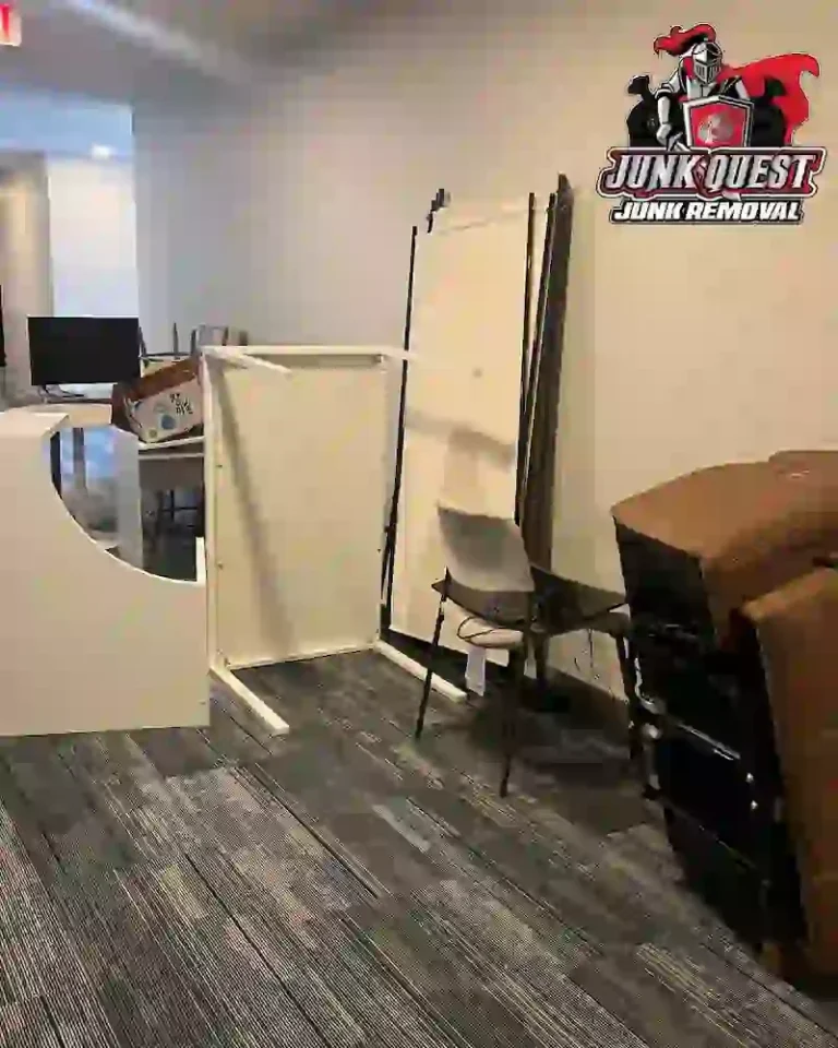 Junk Quest technician assessing a heavily cluttered space during a hoarding cleanout in Dallas, TX.