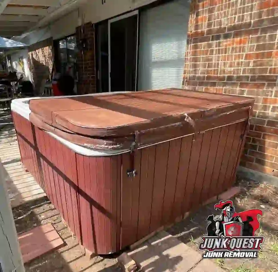 A covered hot tub on a backyard patio, ready for removal by Junk Quest in Prosper, TX.