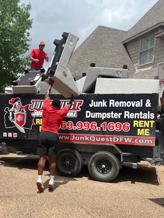 Junk Quest crew hauling furniture and debris during a full house cleanout in Prosper, TX.