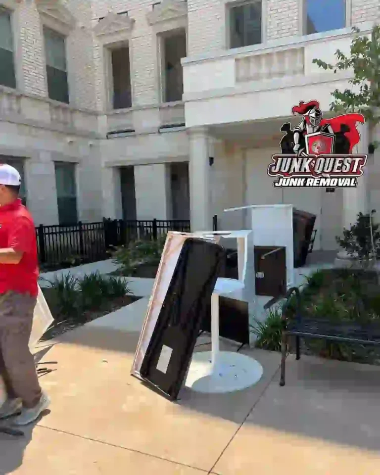 Junk Quest removing an office desk during a commercial cleanout job in Garland, TX