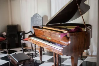 Grand piano in a home, ready for professional removal in Fairview, TX