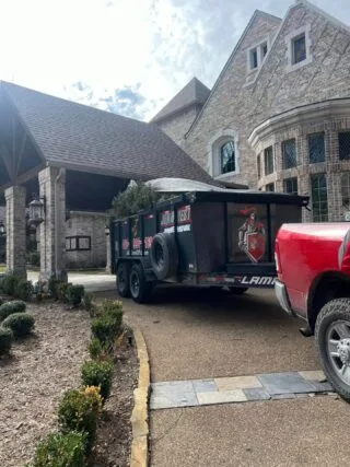 Junk Quest crew removing trash and debris during an attic cleanout in North Dallas.