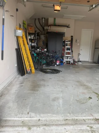 Old treadmill and gym equipment ready for removal by Junk Quest in North Dallas.