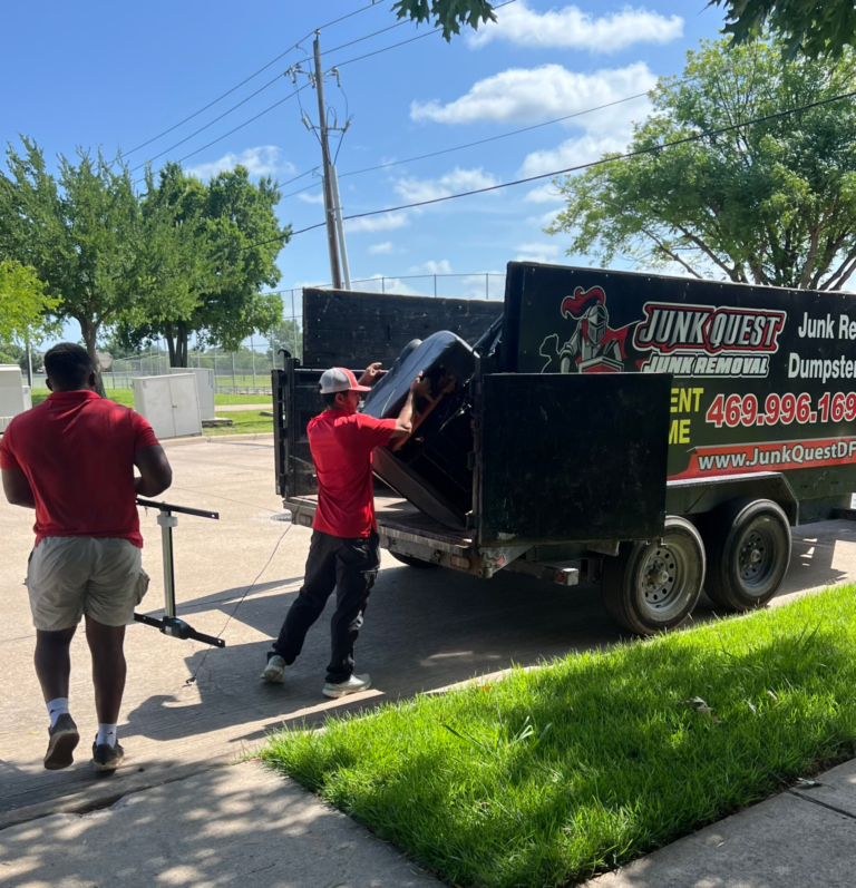 Junk Quest crew loading items during a garage cleanout in Celina, TX.