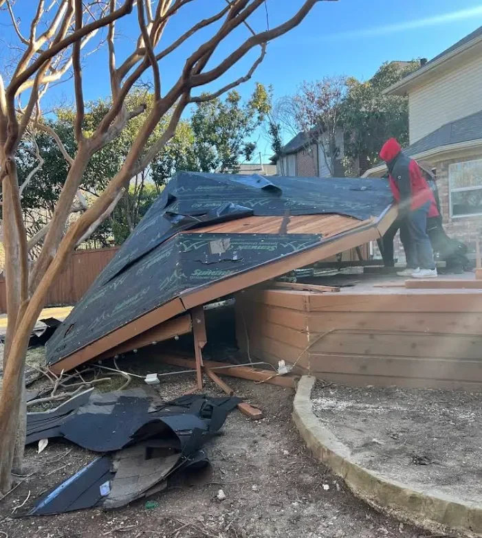 Junk Quest crew removing old deck material in North Dallas