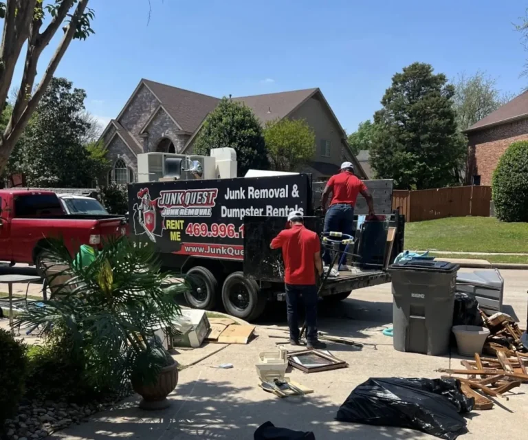 Junk Quest crew loading furniture and appliances onto their trailer during a junk removal job in Allen, TX