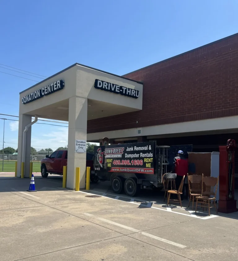 Junk Quest crew unloading furniture from their trailer during a junk removal service in McKinney, TX