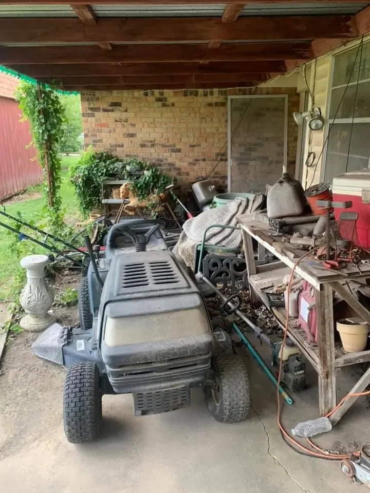 Pile of old lawn tools and equipment ready for junk removal pickup