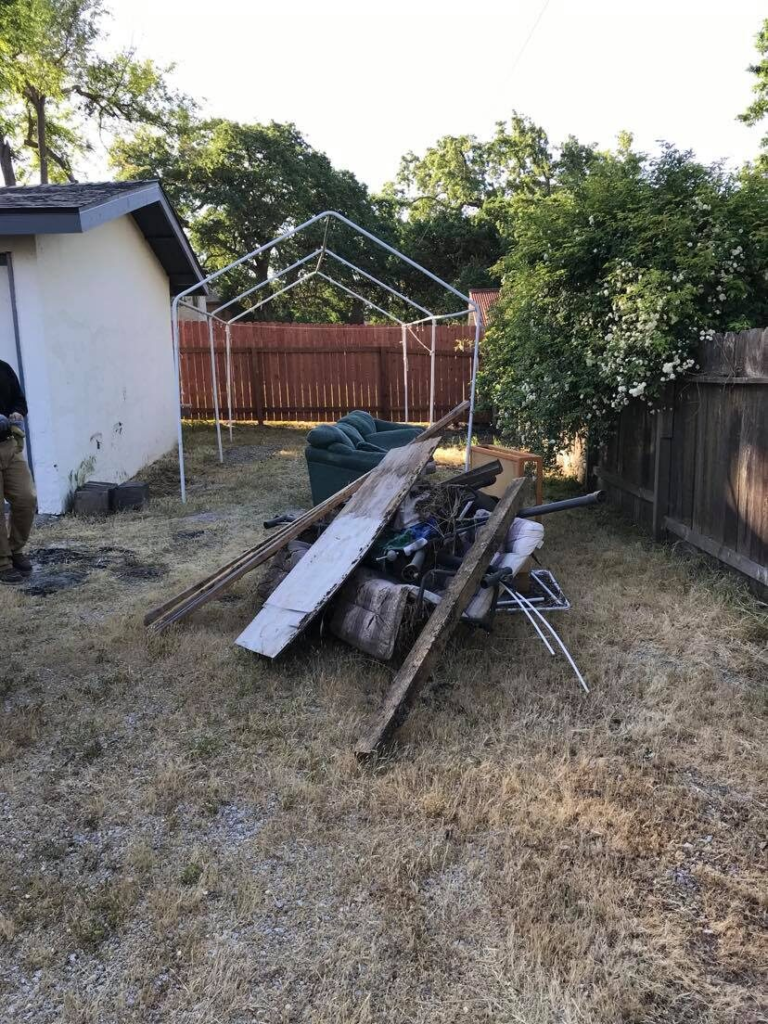 Pile of furniture and debris cleared during a property cleanout